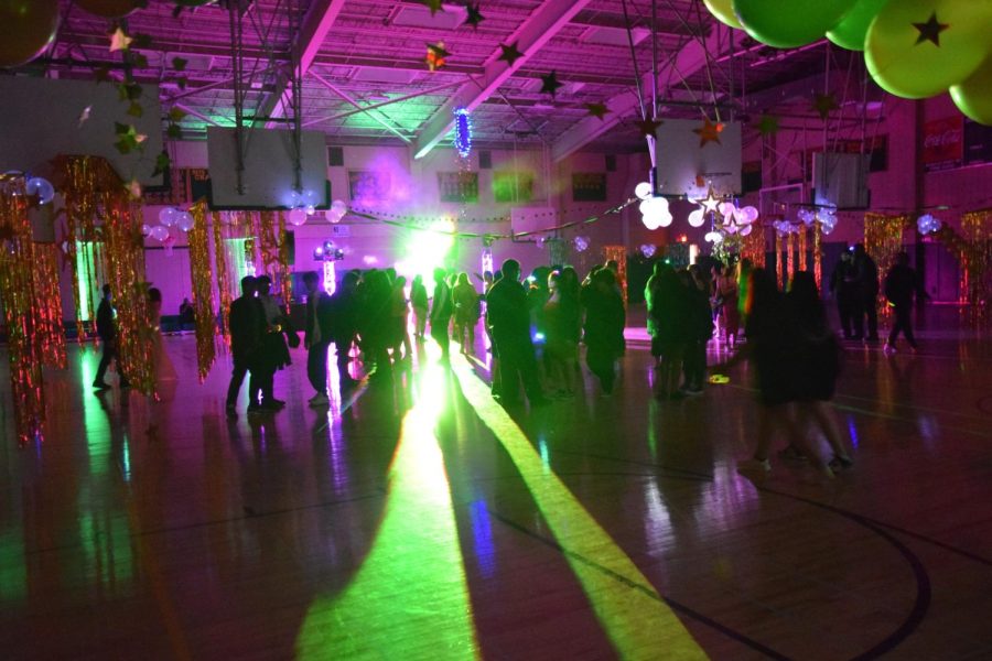 Students continue the Homecoming celebration at the Midnight Dragon Fantasy Dance.